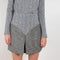 The Grey Wool Skirt by Paco Rabanne is a high waisted mini skirt in a wool bouclette