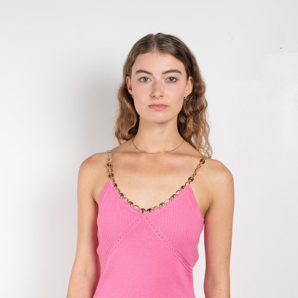The Wool Chain Dress by Paco Rabanne is a bright pink wool dress with a chain collar in a soft merino wool