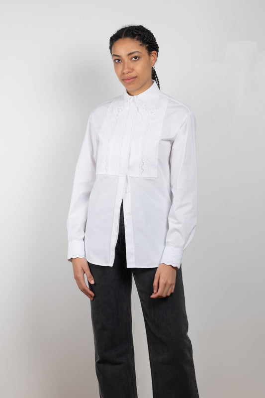 The Chemise 296 by Paco Rabanne is a signature crisp cotton shirt with tonal embroidered details