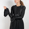 The Velvet Panel Mini Dress by Paco Rabanne is a short dress with a velvet panel, a puffed skirt and long flared sleeves