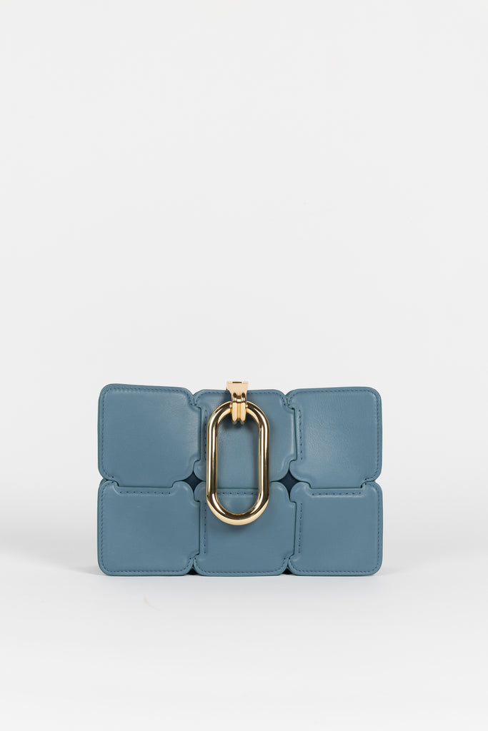 The Paco Ele Shoulder Bag by PACO RABANNE is a structured bag with puzzle detailing and a O-shaped gold-tone closure