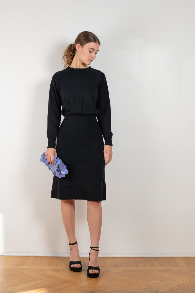The Chain Wool Dress by Paco Rabanne is a fine merino wool dress with a link chain collar, a loose upper part and a fitted skirt