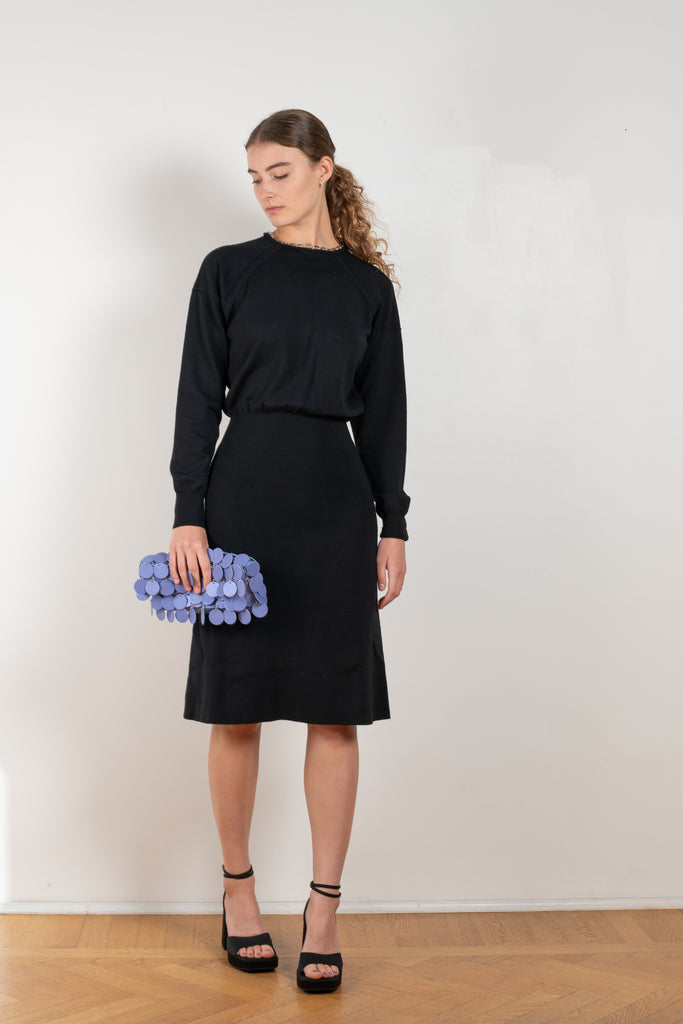 The Chain Wool Dress by Paco Rabanne is a fine merino wool dress with a link chain collar, a loose upper part and a fitted skirt