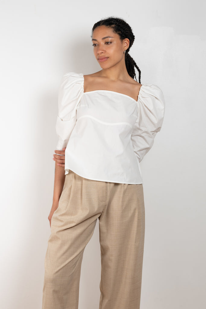 The Anita Blouse by Rejina Pyo is a crisp cotton top with a square neckline and puffed sleeves