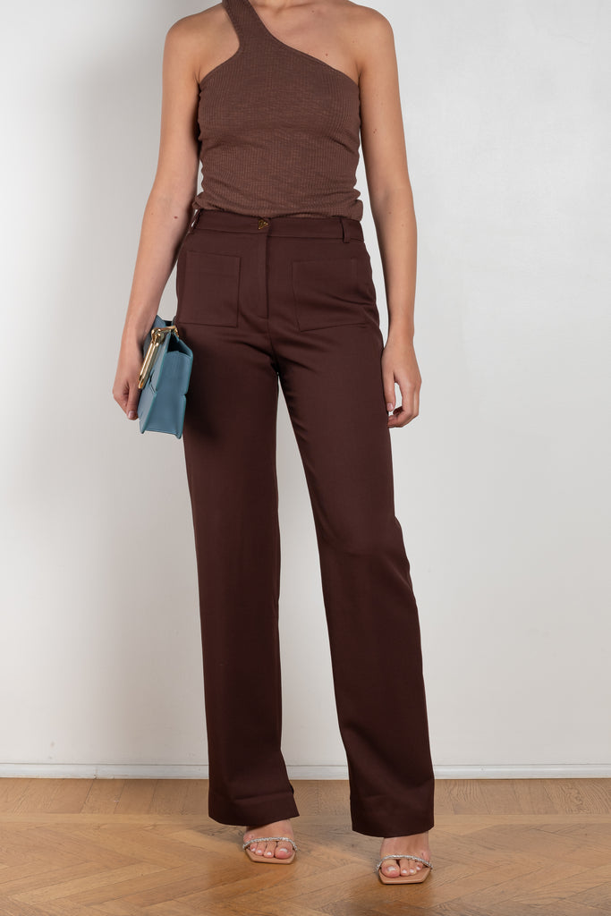 The Ellis Trousers by Rejina Pyo is a high waisted suiting trouser with a straight leg and signature button in a wool twill blend