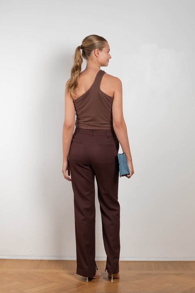 The Ellis Trousers by Rejina Pyo is a high waisted suiting trouser with a straight leg and signature button in a wool twill blend