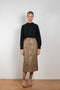 The Riley Skirt by Rejina Pyo is a high waisted pencil skirt with a front slit in a snakeskin faux leather