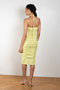 The  Spencer Dress by Rejina Pyo is a fitted dress with a front twist detail in a stretchy seersucker lime green