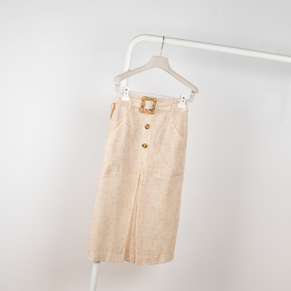 The Tamsin Skirt by Rejina Pyo is a high waisted straight skirt with a buckle belt 