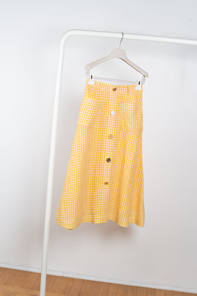 The Rocco Skirt by Rejina Pyo is a mid-length a-line shaped skirt with signature seasonal hand-crafted buttons The Rocco Skirt by Rejina Pyo is a mid-length a-line shaped skirt with signature seasonal hand-crafted buttons 