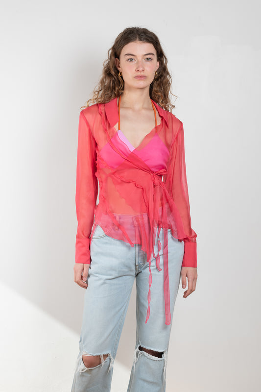 The Yuri Shirt by Rejina Pyo is a silk chiffon wrap top with 2 exaggerated tie fastenings, long sleeves and an asymmetrical back
