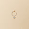 The Boucle Marco Perle Earrings by Sophie Bille Brahe are 14Kt Gold hoop earrings with freshwater pearls descending in size from the front to the back