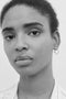 The Claudia Earring by Sophie Bille Brahe is a single hoop earring with pearls, which captures Sophie Bille Brahe’s minimalistic sensibility and clean Scandinavian aesthetic