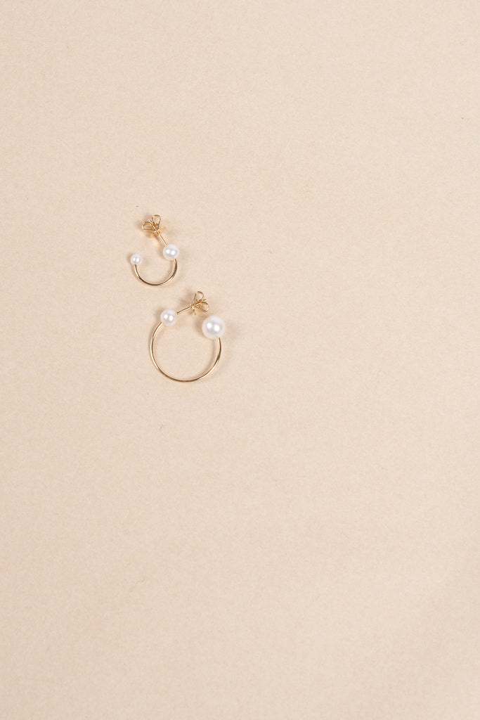 The Claudia Earring by Sophie Bille Brahe is a single hoop earring with pearls, which captures Sophie Bille Brahe’s minimalistic sensibility and clean Scandinavian aestheticThe Claudia Earring by Sophie Bille Brahe is a single hoop earring with pearls, which captures Sophie Bille Brahe’s minimalistic sensibility and clean Scandinavian aesthetic