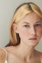 The Croissant Trois Earring by Sophie Bille Brahe is a smaller, delicate earring featuring three diamonds graduating in size which lends perfectly to mix and match other SBB pieces