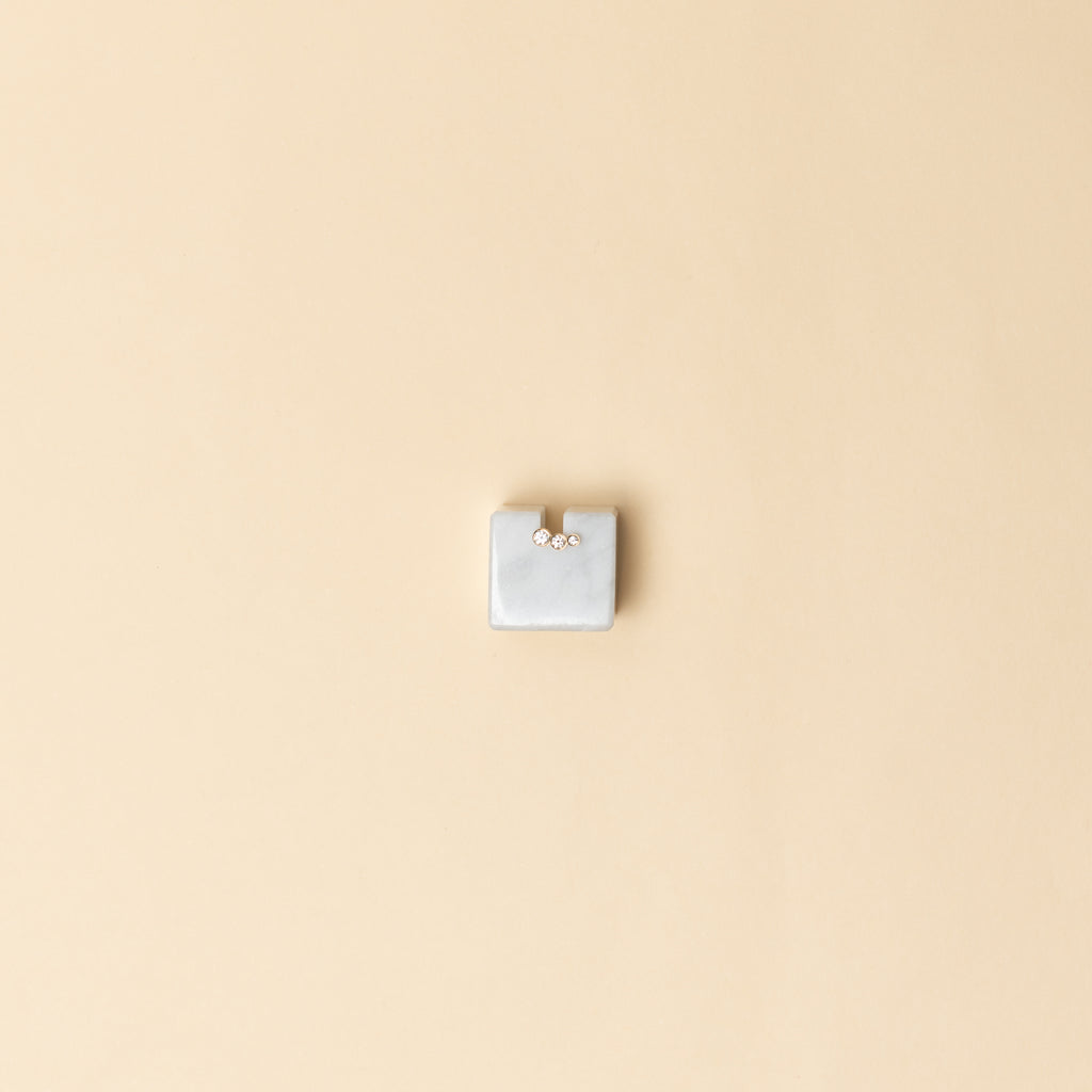 The Croissant Trois Earring by Sophie Bille Brahe is a smaller, delicate earring featuring three diamonds graduating in size which lends perfectly to mix and match other SBB pieces