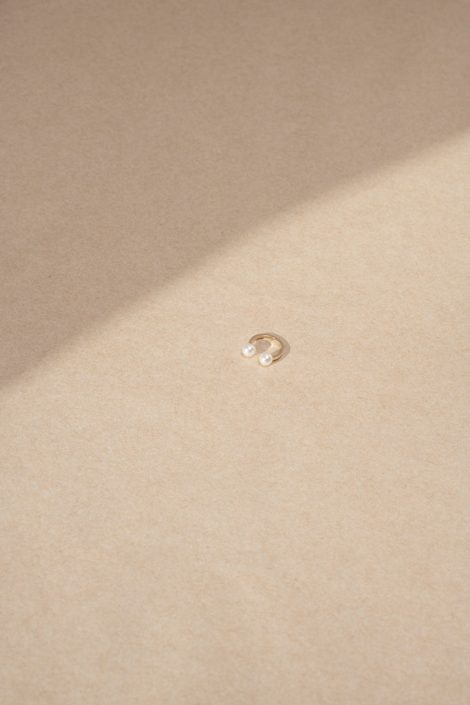 The Emma Deux Earcuff is a delicate 14 Kt Pearl Earcuff which slides over the side of your ear