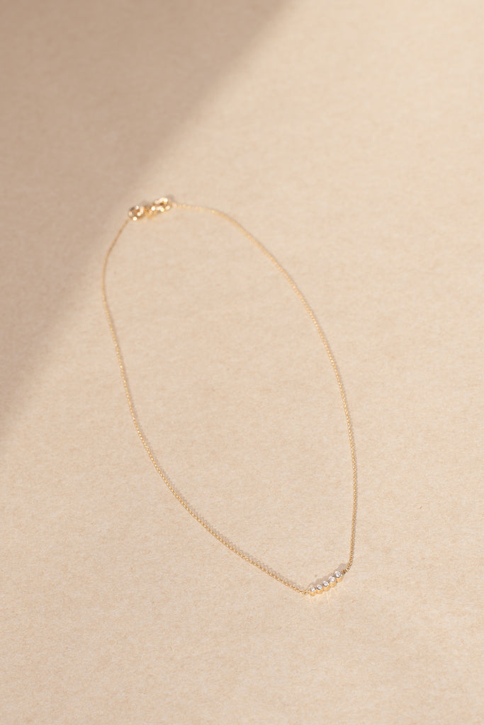 The Lune Necklace by Sophie Bille Brahe is a fine 18Kt Gold necklace with diamonds graduating from small to largeThe Lune Necklace by Sophie Bille Brahe is a fine 18Kt Gold necklace with diamonds graduating from small to large