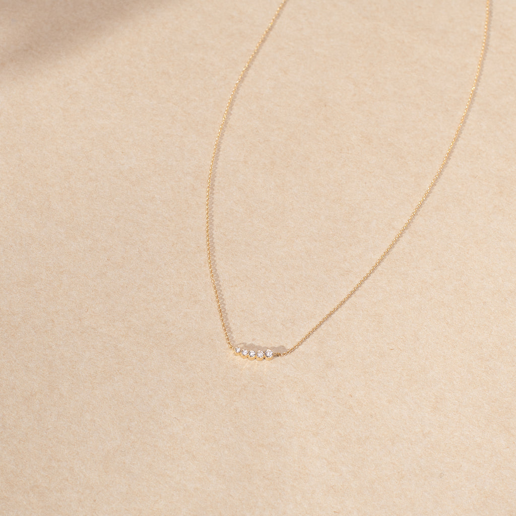 The Lune Necklace by Sophie Bille Brahe is a fine 18Kt Gold necklace with diamonds graduating from small to large