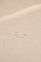 The Marco Earrings by Sophie Bille Brahe are small 14Kt Gold hoop earrings with freshwater pearls