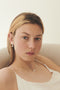 The Margherita Perle Earrings by Sophie Bille Brahe are small 14Kt Gold earrings with freshwater pearls and a single pendant pearl