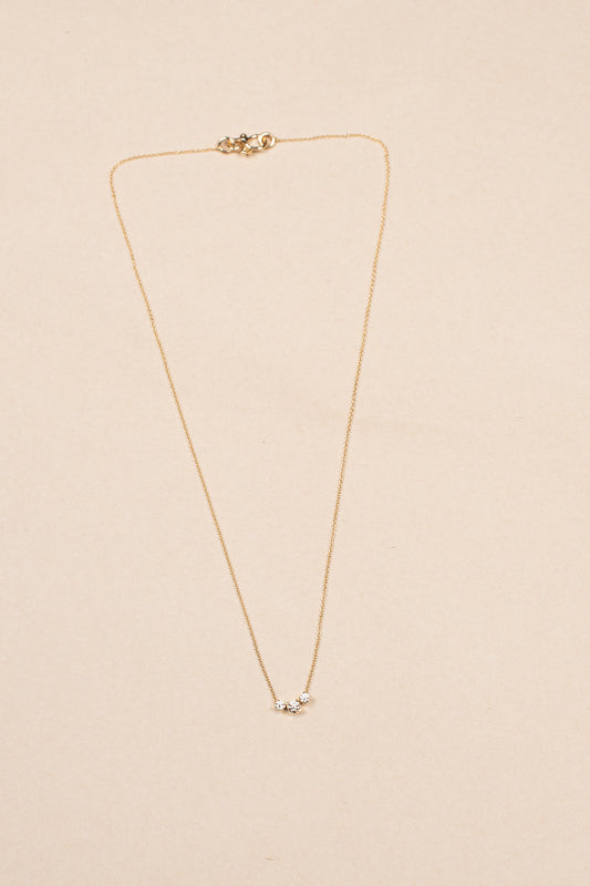 The Orangerie Trois Necklace by Sophie Bille Brahe has three petite diamonds that sit loose on the delicate gold chain allowing them to move elegantly as the necklace is worn