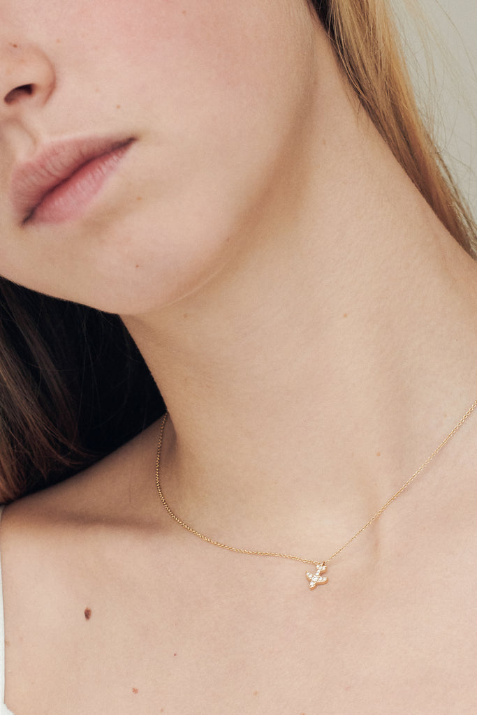 The Petite Matisse Necklace by Sophie Bille Brahe is a fine 18Kt Gold necklace with diamonds set in a dove shaped charm inspired by the artist Henri Matisse