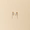 The Petite Perle Nuit Earrings by Sophie Bille Brahe are 14Kt Gold earrings with dropdown freshwater pearls descending in size