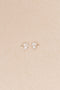 The Bisou Earring by Sophie Bille Brahe is a delicate stud earring in 14 Kt Gold with a small cluster of white freshwater pearls varying in size