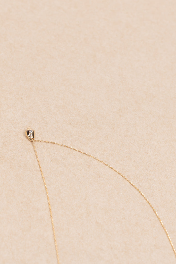 The Conque d'Or Diamant by Sophie Bille Brahe is a delicate Necklace with a Conque pendant in 18K yellow gold with 0,18 ct Top Wesselton VVS diamonds