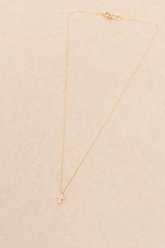 The Giulietta Necklace by Sophie Bille Brahe is a delicate necklace in 18K yellow gold and five 0.06 carat Top Wesselton VVS diamonds set in a cross shape