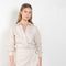 The Fiona Dress by Xirena is a soft linen tie wrap mini dress