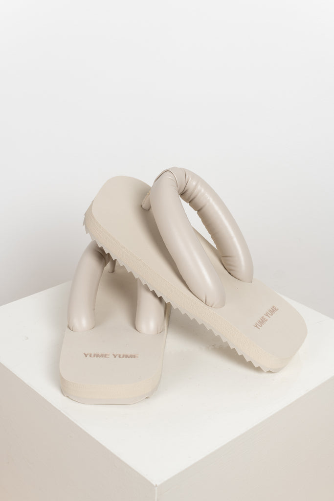 The Suki Slides by Yume Yume are relaxed fit flip flop slides with chunky straps inspired by the iconic Japanese Geta shapeThe Suki Slides by Yume Yume are relaxed fit flip flop slides with chunky straps inspired by the iconic Japanese Geta shape